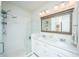 Bright bathroom with double sink vanity, modern fixtures, and glass enclosed walk-in shower with subway tile at 5009 W Liberty Park Cir, North Charleston, SC 29405
