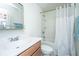 Practical bathroom featuring a vanity with storage, a shower-tub combo, and a mirror at 5009 W Liberty Park Cir, North Charleston, SC 29405