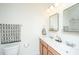 Bright bathroom featuring a double sink vanity, a large mirror, and good lighting at 5009 W Liberty Park Cir, North Charleston, SC 29405