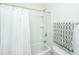 Cozy bathroom with a shower-tub combo, light walls, and a shower curtain at 5009 W Liberty Park Cir, North Charleston, SC 29405