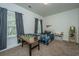 Cozy bedroom with a foosball table and large window providing natural light at 5009 W Liberty Park Cir, North Charleston, SC 29405