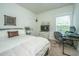 Comfortable bedroom featuring a queen-size bed, desk, and window for natural light at 5009 W Liberty Park Cir, North Charleston, SC 29405
