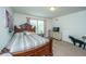 Spacious bedroom with a large bed, dresser, and window offering a serene view at 5009 W Liberty Park Cir, North Charleston, SC 29405