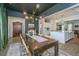 Chic dining space with modern chandelier and easy access to the open kitchen area at 5009 W Liberty Park Cir, North Charleston, SC 29405