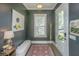 Stylish foyer with hardwood floors, elegant lighting, and neutral decor, creating a welcoming entrance to the home at 5009 W Liberty Park Cir, North Charleston, SC 29405