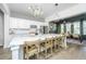 Spacious kitchen showcasing a large island with seating and open flow to dining area at 5009 W Liberty Park Cir, North Charleston, SC 29405