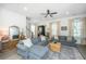 Cozy living room with hardwood floors, fireplace, large windows, and comfortable seating, creating a warm and inviting space at 5009 W Liberty Park Cir, North Charleston, SC 29405