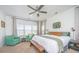 Serene main bedroom featuring neutral tones, ample natural light, and comfortable seating area at 5009 W Liberty Park Cir, North Charleston, SC 29405