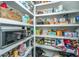 Walk-in pantry with organized shelving provides ample storage space for all your essentials at 5009 W Liberty Park Cir, North Charleston, SC 29405