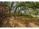 Beautiful property with large mature trees and a well-maintained lawn at 5009 W Liberty Park Cir, North Charleston, SC 29405