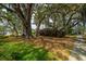 Charming neighborhood street with mature trees and sidewalk at 5009 W Liberty Park Cir, North Charleston, SC 29405