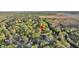 An aerial view highlights a lovely home in a peaceful, wooded neighborhood with access to a nearby body of water at 506 Fairington Dr, Summerville, SC 29485
