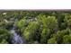 Scenic aerial shot of a house next to a river surrounded by trees, creating a private and tranquil environment at 506 Fairington Dr, Summerville, SC 29485