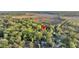 Expansive aerial view of a charming home nestled in a lush, green wooded area near a marsh, offering privacy at 506 Fairington Dr, Summerville, SC 29485