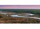 Picturesque aerial shot of a winding river and lush marshlands at 506 Fairington Dr, Summerville, SC 29485