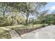 Relaxing backyard featuring a mature tree with a swing and path to the water at 506 Fairington Dr, Summerville, SC 29485