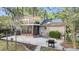 Backyard featuring a brick home, sunroom, balcony, and a grill at 506 Fairington Dr, Summerville, SC 29485