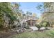 Backyard view of brick home featuring a sunroom with balcony at 506 Fairington Dr, Summerville, SC 29485
