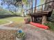 Manicured backyard featuring a unique treehouse deck and beautiful landscaping, a serene retreat at 506 Fairington Dr, Summerville, SC 29485