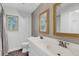 Bright bathroom featuring double vanity with matching mirrors, a toilet, and a window at 506 Fairington Dr, Summerville, SC 29485