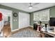 Bedroom with wooden floors, gray rug, closet, dartboard, ceiling fan, and bright window at 506 Fairington Dr, Summerville, SC 29485