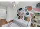 Stylish bedroom with unique wallpaper, chandelier, and a cozy daybed at 506 Fairington Dr, Summerville, SC 29485