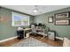 Bedroom with wooden floors, gray rug, desk and chair, ceiling fan, and bright window at 506 Fairington Dr, Summerville, SC 29485