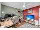 Bedroom featuring wood floors, a ceiling fan, television, and a work space setup at 506 Fairington Dr, Summerville, SC 29485