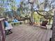 Relaxing outdoor deck features bench seating and Adirondack chairs, perfect for entertaining guests at 506 Fairington Dr, Summerville, SC 29485