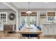 The dining area features a wood table and modern decor, perfect for Gathering meals at 506 Fairington Dr, Summerville, SC 29485