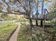 Charming outdoor space featuring a wooden treehouse deck surrounded by natural landscaping and scenic views at 506 Fairington Dr, Summerville, SC 29485