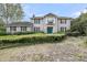 Charming two-story home with blue door and manicured front yard landscaping at 506 Fairington Dr, Summerville, SC 29485