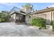 Brick home featuring a sunroom with balcony, and concrete patio at 506 Fairington Dr, Summerville, SC 29485