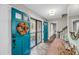 Foyer with striking blue doors, decorative wreath, and access to the staircase and living areas at 506 Fairington Dr, Summerville, SC 29485