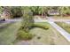 Landscaped front yard with a large tree and a circular driveway at 506 Fairington Dr, Summerville, SC 29485