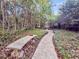 Beautiful garden path with stone bench and water feature, creating a tranquil outdoor setting at 506 Fairington Dr, Summerville, SC 29485