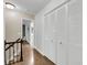 Hallway with hardwood floors, closet, and view into the main bathroom at 506 Fairington Dr, Summerville, SC 29485