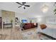 Bright living room with a brick accent wall, cozy seating, and updated lighting at 506 Fairington Dr, Summerville, SC 29485