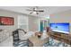 Comfortable living room with a ceiling fan, large TV, and stylish furniture at 506 Fairington Dr, Summerville, SC 29485