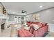 Bright living room featuring fireplace, hardwood floors, and a cozy sectional sofa at 506 Fairington Dr, Summerville, SC 29485