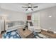 Bright living room featuring ceiling fan, area rug, modern furniture and plenty of natural light at 506 Fairington Dr, Summerville, SC 29485