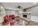 Inviting living room with brick fireplace, hardwood floors and a comfortable sectional sofa at 506 Fairington Dr, Summerville, SC 29485