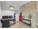 Well-lit office space featuring a brick accent wall, desk area and modern appliances at 506 Fairington Dr, Summerville, SC 29485