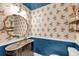 Charming powder room with peacock wallpaper, ornate fixtures, and a stylish vanity at 506 Fairington Dr, Summerville, SC 29485