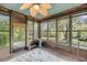 Bright sunroom with large windows, ceiling fan, indoor exercise equipment, and a blue patterned rug at 506 Fairington Dr, Summerville, SC 29485
