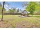 Expansive backyard with a charming bench seating area, perfect for relaxing and enjoying nature at 509 Hill St, Moncks Corner, SC 29461