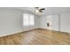 Bright bedroom featuring sleek wood floors, fresh paint, and an attached bathroom at 509 Hill St, Moncks Corner, SC 29461
