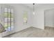 Bright dining area with backyard access, modern pendant lighting, and seamlessly connects to adjacent rooms at 509 Hill St, Moncks Corner, SC 29461