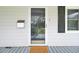 Covered front porch with front door and welcome mat at 509 Hill St, Moncks Corner, SC 29461