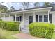 Inviting front porch with classic railings and meticulously maintained landscaping at 509 Hill St, Moncks Corner, SC 29461
